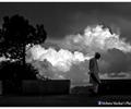 Stages of Life - growing tree, rising clouds and bending old shoulders